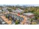 Scenic aerial view of townhouses and the city skyline nestled among lush green trees at 1199 Huff Nw Rd # 112, Atlanta, GA 30318