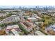 Aerial view of complex, trees and skyline, with a red pin indicating property location at 1199 Huff Nw Rd # 112, Atlanta, GA 30318