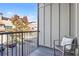 Comfortable outdoor balcony with a chair, pillow, and neighborhood views in the background at 1199 Huff Nw Rd # 112, Atlanta, GA 30318