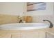 Modern bathtub with tile surround and faucet fixture at 1199 Huff Nw Rd # 112, Atlanta, GA 30318