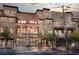 Multi-story brick building with iron fencing, mature trees, and street view presents an urban design at 1199 Huff Nw Rd # 112, Atlanta, GA 30318
