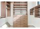 Walk-in closet featuring built in shelving and drawers with carpet flooring at 1199 Huff Nw Rd # 112, Atlanta, GA 30318