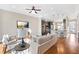 Comfortable living room flows into the modern kitchen with hardwood floors and an open design at 1199 Huff Nw Rd # 112, Atlanta, GA 30318