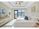 Spacious main bedroom with tray ceilings and a sliding glass door to the exterior balcony at 1199 Huff Nw Rd # 112, Atlanta, GA 30318