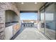 Private patio and outdoor kitchen boasts stone accents, a wet bar, and outdoor seating at 1199 Huff Nw Rd # 112, Atlanta, GA 30318