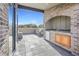 A wet bar with stone accents, a sink, and an outdoor kitchen on the private patio at 1199 Huff Nw Rd # 112, Atlanta, GA 30318