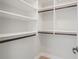 Bright walk-in closet with organized shelving and hanging rods, ready for storage at 1199 Huff Nw Rd # 112, Atlanta, GA 30318