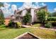 Spacious backyard featuring a deck, lush greenery, and well-maintained landscaping at 1430 Hampton Hill Dr, Alpharetta, GA 30022