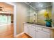 Home bar area with glass shelves, mirrored backsplash, and a sink perfect for entertaining at 1430 Hampton Hill Dr, Alpharetta, GA 30022