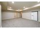 Spacious finished basement with recessed lighting, double doors, and a refrigerator at 1430 Hampton Hill Dr, Alpharetta, GA 30022