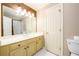 This bathroom has a large mirror, bright vanity and a shower with glass doors at 1430 Hampton Hill Dr, Alpharetta, GA 30022