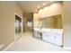 Expansive bathroom with a vanity, tile flooring, and a large mirror reflecting natural light at 1430 Hampton Hill Dr, Alpharetta, GA 30022