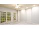 This bedroom has many windows, a ceiling fan and neutral walls at 1430 Hampton Hill Dr, Alpharetta, GA 30022