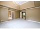 Bright bedroom showcasing neutral walls, plush carpeting, and doorways leading to other rooms at 1430 Hampton Hill Dr, Alpharetta, GA 30022