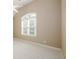 Cozy bedroom showcasing a vaulted ceiling, neutral walls, and a bright window at 1430 Hampton Hill Dr, Alpharetta, GA 30022
