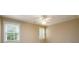 Bright bedroom showcasing a ceiling fan and multiple windows offering natural light at 1430 Hampton Hill Dr, Alpharetta, GA 30022