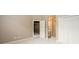 Neutral bedroom with double closets and open doorway to upstairs at 1430 Hampton Hill Dr, Alpharetta, GA 30022