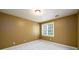Standard bedroom has carpeted floor and a window to provide natural light at 1430 Hampton Hill Dr, Alpharetta, GA 30022