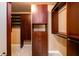 Organized walk-in closet with custom wood shelving, drawers, and ample storage space at 1430 Hampton Hill Dr, Alpharetta, GA 30022