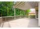Spacious outdoor deck with pergola, perfect for relaxing and entertaining with views of lush greenery at 1430 Hampton Hill Dr, Alpharetta, GA 30022