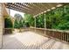 Spacious outdoor deck with pergola, perfect for relaxing and entertaining with views of lush greenery at 1430 Hampton Hill Dr, Alpharetta, GA 30022