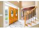 Grand foyer with marble floors, staircase and view into the formal dining room at 1430 Hampton Hill Dr, Alpharetta, GA 30022