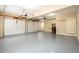 A clean and spacious garage features two doors, ample storage, and epoxy floor at 1430 Hampton Hill Dr, Alpharetta, GA 30022