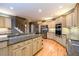 Spacious kitchen with granite countertops, stainless steel appliances, and light wood flooring at 1430 Hampton Hill Dr, Alpharetta, GA 30022