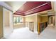 Spacious second floor landing with view of the backyard through large window and wrought iron railing at 1430 Hampton Hill Dr, Alpharetta, GA 30022