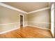 Bright, open living room with hardwood floors and wainscoting and lots of natural light at 1430 Hampton Hill Dr, Alpharetta, GA 30022