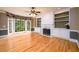 Bright living room with hardwood floors, fireplace, built-in shelves, and a large bay window at 1430 Hampton Hill Dr, Alpharetta, GA 30022