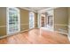 Living room showcasing hardwood floors, with an open view to the foyer at 1430 Hampton Hill Dr, Alpharetta, GA 30022