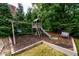 Backyard playground with a swing set, slide, and climbing structure at 1430 Hampton Hill Dr, Alpharetta, GA 30022