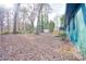 Large backyard featuring mature trees, wooden deck and detached storage shed at 1760 Detroit Nw Ave, Atlanta, GA 30314