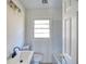 Bright bathroom featuring a white vanity, toilet and tub/shower combination at 1760 Detroit Nw Ave, Atlanta, GA 30314