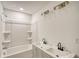 Well-lit bathroom featuring a tub and shower combination and double vanity sinks at 1760 Detroit Nw Ave, Atlanta, GA 30314