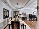 Elegant dining room features tray ceiling, hardwood floors and a large formal dining set at 2695 Ridge Run Trl, Duluth, GA 30097