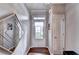 Inviting entryway with hardwood floors, a decorative mirror, and a bright, welcoming door at 2695 Ridge Run Trl, Duluth, GA 30097