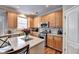 Well-equipped kitchen with stainless steel appliances, light wood cabinets, and center island at 2695 Ridge Run Trl, Duluth, GA 30097