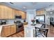 Well-equipped kitchen with stainless steel appliances, light wood cabinets, and center island at 2695 Ridge Run Trl, Duluth, GA 30097