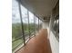Enjoy the covered balcony with expansive windows and a ceiling fan for year-round comfort at 3060 Pharr Court N N Ct # 607, Atlanta, GA 30305
