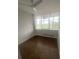Clean room with hardwood floors, fan, and bright light with great views from large windows at 3060 Pharr Court N N Ct # 607, Atlanta, GA 30305