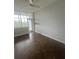 Bright room with hardwood floors, fan, and glass doors to the balcony with gorgeous views at 3060 Pharr Court N N Ct # 607, Atlanta, GA 30305
