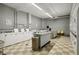 Bright laundry room featuring multiple washing machines and folding tables for resident convenience at 3060 Pharr Court N N Ct # 607, Atlanta, GA 30305