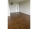 Spacious living room with hardwood floors and a modern lighting fixture at 3060 Pharr Court N N Ct # 607, Atlanta, GA 30305