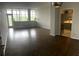 Bright and airy living room with hardwood floors and a view of the kitchen at 3060 Pharr Court N N Ct # 607, Atlanta, GA 30305