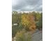 Window view overlooking fall foliage, trees and a parking lot at 3060 Pharr Court N N Ct # 607, Atlanta, GA 30305
