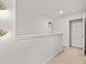 Upstairs hallway with a view of a closet and neutral-colored walls at 3084 Yellowhammer Dr, Marietta, GA 30064