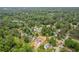 Aerial view of 565 Deer Run neighborhood with lush greenery at 565 Deer Sw Run, Lilburn, GA 30047