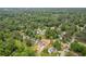 An aerial view of the neighborhood with lush greenery surrounding the homes at 565 Deer Sw Run, Lilburn, GA 30047
